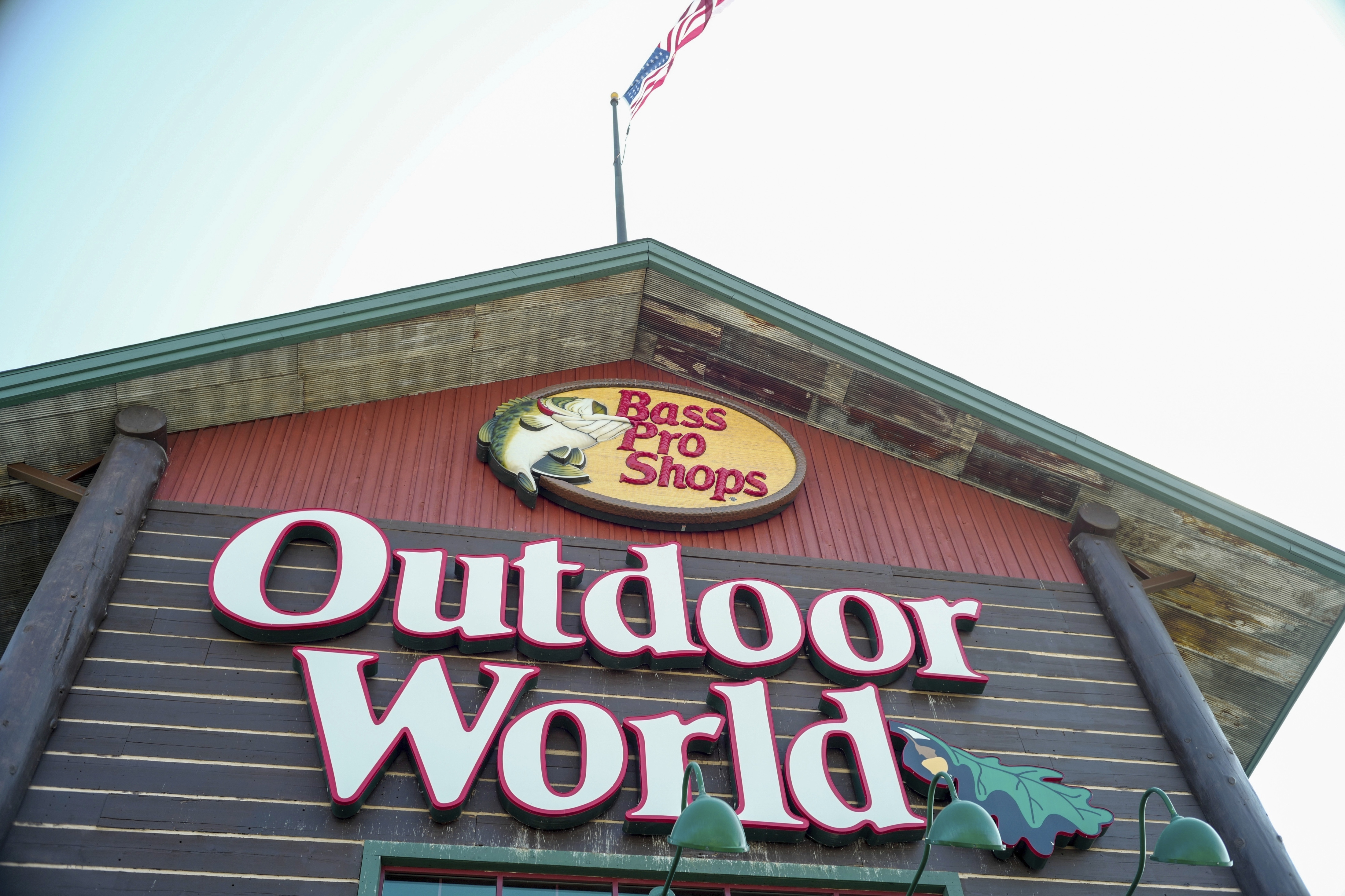 In this Sept. 19, 2017 file photo, the Bass Pro Shops logo is seen at the entrance to a store in Council Bluffs, Iowa. Police in Alabama say a man crashed his car outside a Bass Pro Shop, Thursday night, Jan. 4, 2024, and stripped down to his birthday suit and then plunged into the giant aquarium inside the store. (AP Photo/Nati Harnik, File)