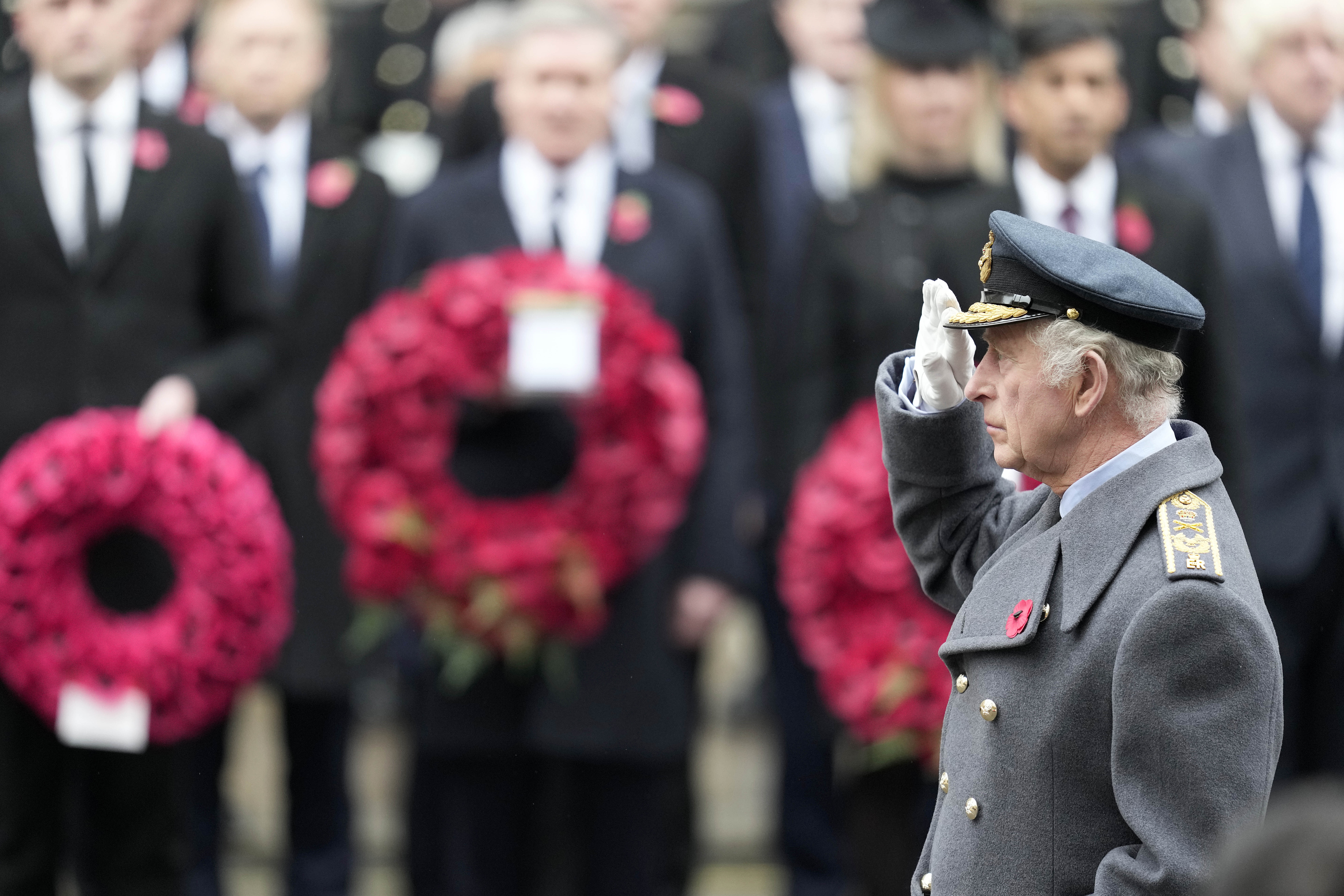 FILE - Britain's King Charles III salutes as he attends the Remembrance Sunday ceremony at the Cenotaph on Whitehall in London, Sunday, Nov. 12, 2023. Buckingham Palace says King Charles III will undergo a “corrective procedure” next week for an enlarged prostate. (AP Photo/Kin Cheung, Pool, File)