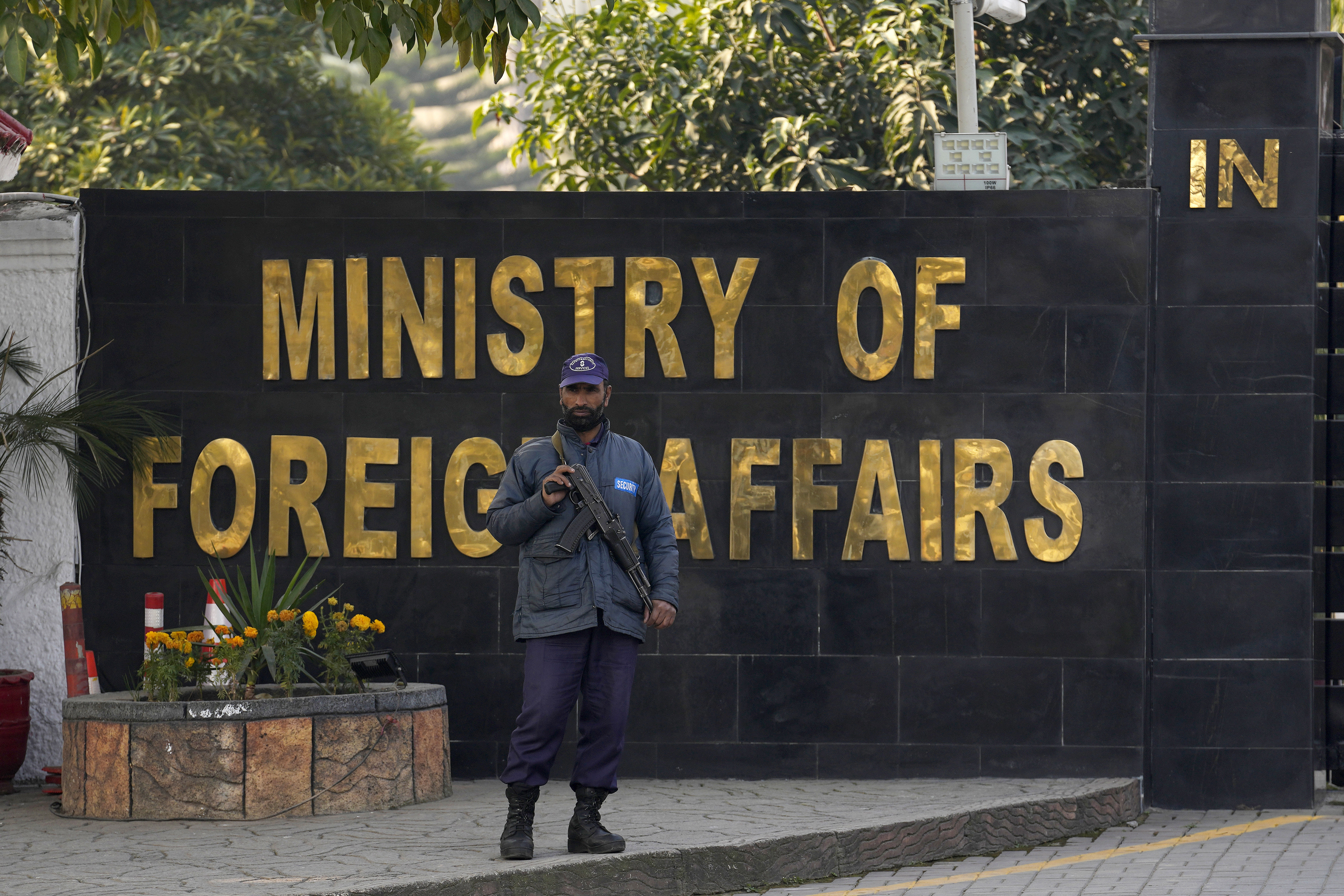 A police officer stands guard at the main entry gate of Pakistan's Ministry of Foreign Affairs, in Islamabad, Pakistan, Thursday, Jan. 18, 2024. Pakistan's air force launched retaliatory airstrikes early Thursday on Iran allegedly targeting militant positions, an attack that killed at least seven people and further raised tensions between the neighboring nations. (AP Photo/Anjum Naveed)